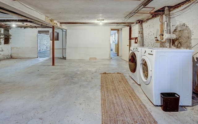 unfinished below grade area featuring washing machine and dryer