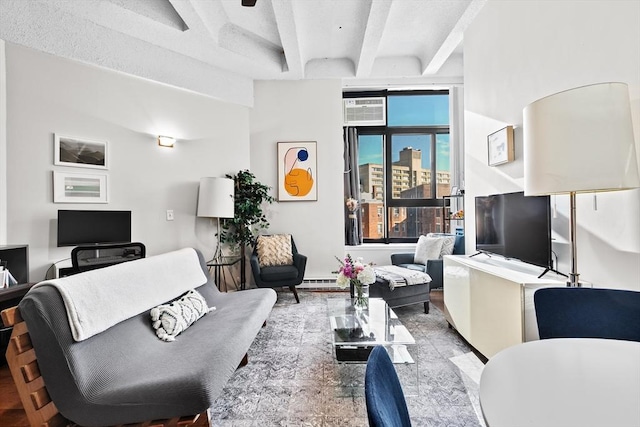 living room featuring a wall unit AC and beam ceiling