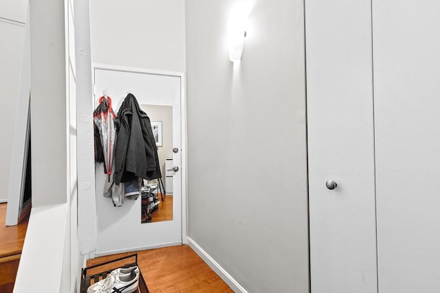 mudroom with baseboards and light wood finished floors