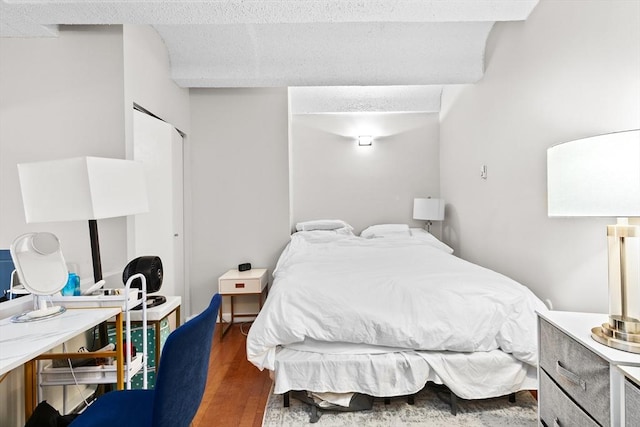 bedroom featuring wood finished floors