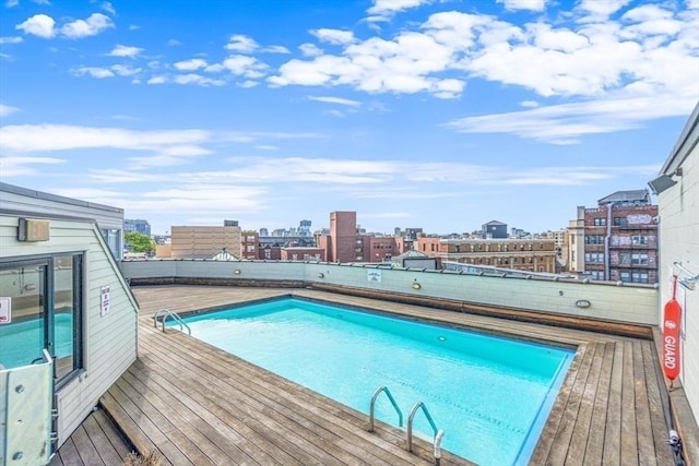 view of pool featuring a view of city