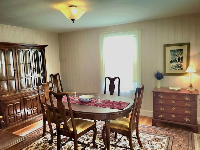 dining room with hardwood / wood-style flooring