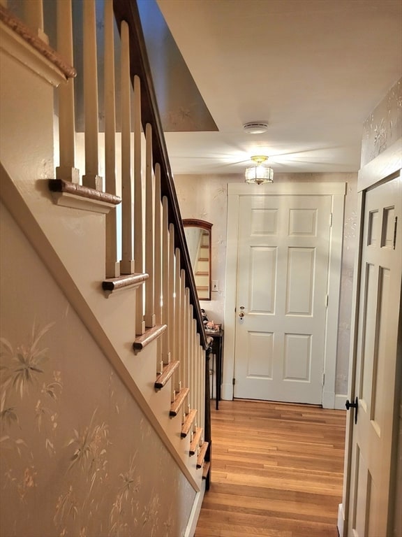 entryway with hardwood / wood-style flooring