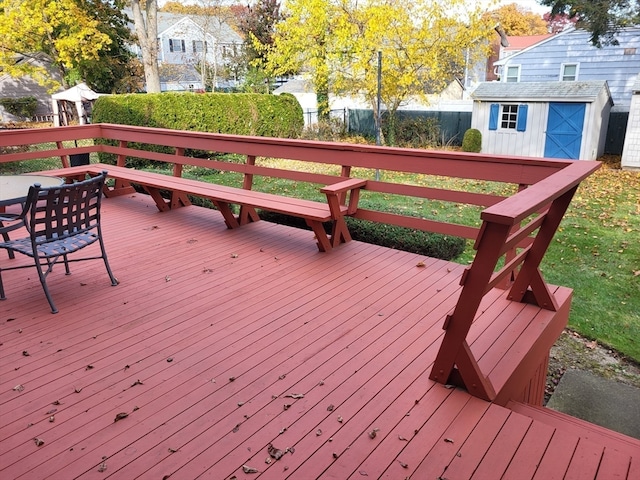 wooden deck featuring a storage shed