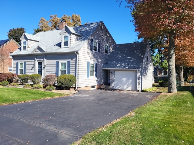 cape cod-style house with a front yard and a garage