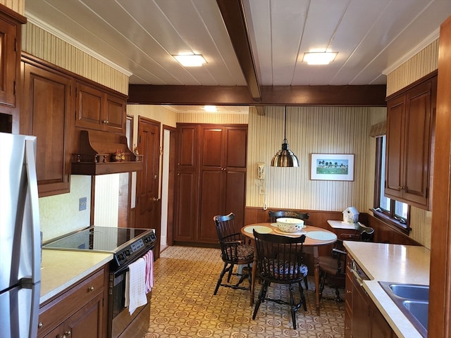 kitchen with premium range hood, stainless steel appliances, pendant lighting, sink, and beamed ceiling