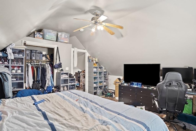 bedroom featuring ceiling fan, lofted ceiling, and a closet