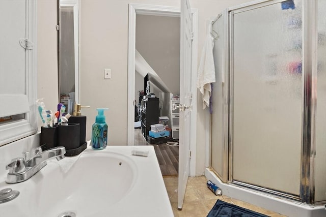 full bath with a shower stall and vanity
