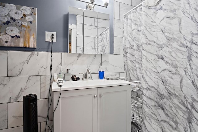 full bathroom with tile walls, curtained shower, and vanity