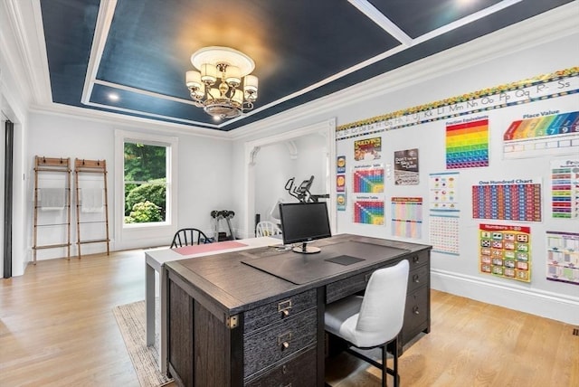 office with a chandelier, light wood-style flooring, crown molding, and a raised ceiling