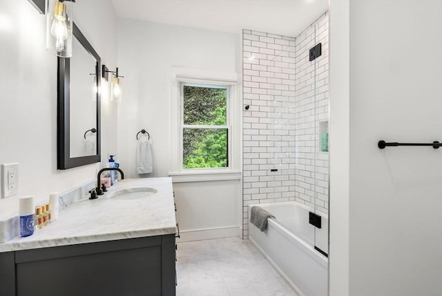bathroom featuring shower / bathing tub combination, baseboards, and vanity