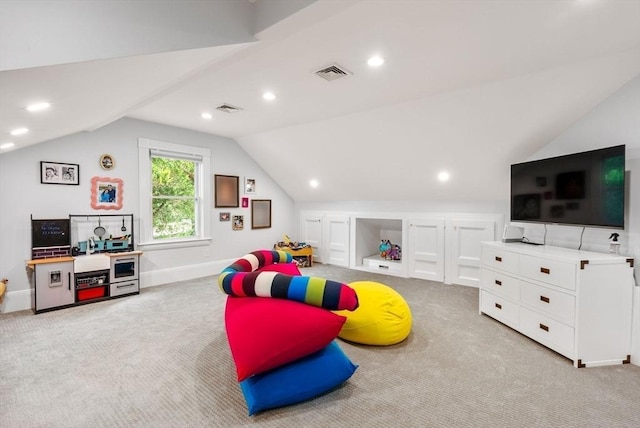 playroom featuring visible vents, baseboards, carpet, and vaulted ceiling