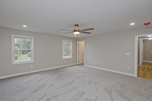 unfurnished room featuring ceiling fan, recessed lighting, carpet flooring, and baseboards