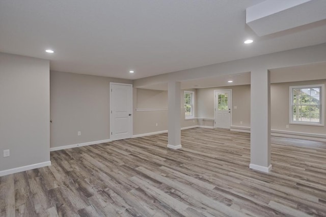 below grade area with recessed lighting, baseboards, and wood finished floors