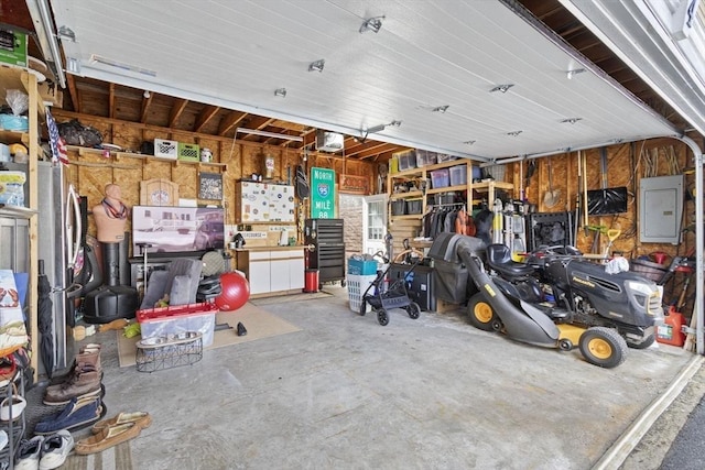 garage featuring a garage door opener and electric panel