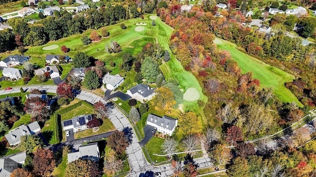 aerial view featuring view of golf course and a residential view