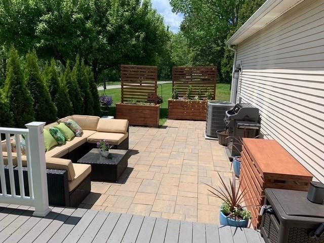 view of patio featuring cooling unit and an outdoor hangout area