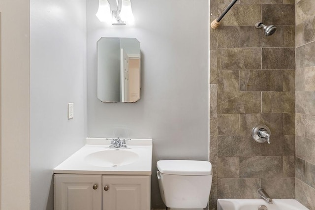 full bathroom with bathing tub / shower combination, toilet, and vanity