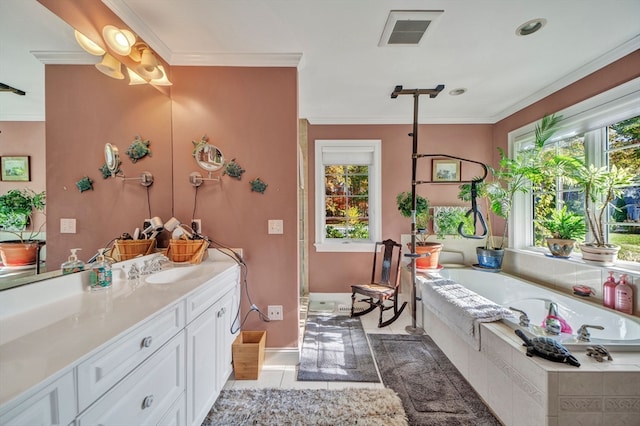 bathroom with vanity, tile patterned flooring, tiled bath, and a wealth of natural light