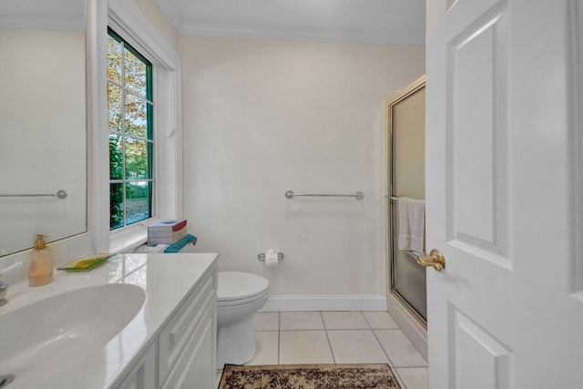 bathroom with a shower with shower door, toilet, tile patterned floors, vanity, and crown molding