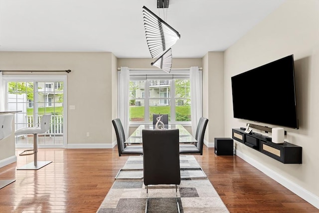 5 Manor Dr Unit B, Hooksett, NH 03106 - dining area with healthy amount of natural light, wood finished floors, and baseboards