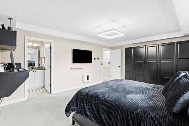 5 Manor Dr Unit B, Hooksett, NH 03106 - bedroom with light colored carpet, baseboards, attic access, and ensuite bathroom