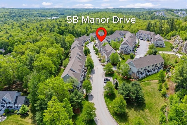 5 Manor Dr Unit B, Hooksett, NH 03106 - aerial view of residential area featuring a heavily wooded area