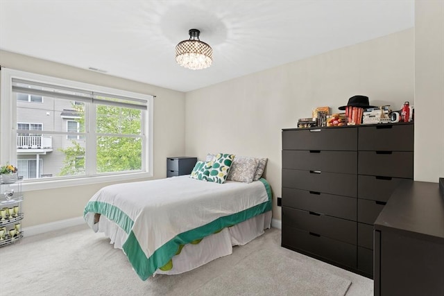 5 Manor Dr Unit B, Hooksett, NH 03106 - carpeted bedroom featuring baseboards and a chandelier