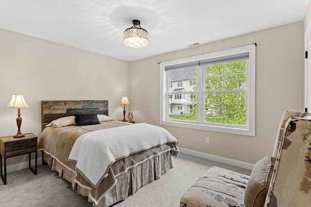 5 Manor Dr Unit B, Hooksett, NH 03106 - bedroom featuring baseboards, carpet, and a chandelier