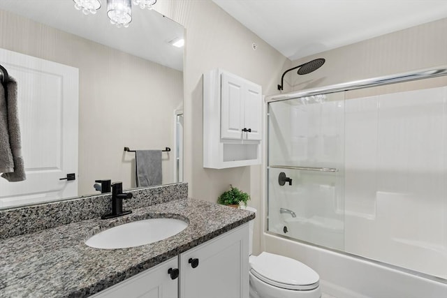 5 Manor Dr Unit B, Hooksett, NH 03106 - bathroom with toilet, vanity, and combined bath / shower with glass door