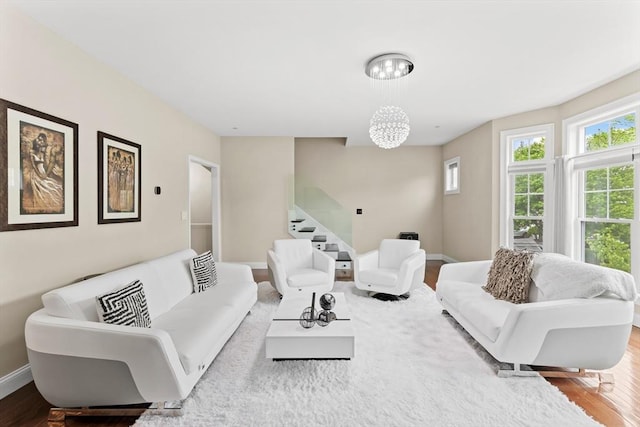 5 Manor Dr Unit B, Hooksett, NH 03106 - living room with stairway, baseboards, wood finished floors, and a chandelier