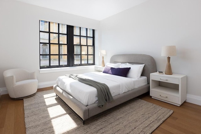 bedroom featuring wood-type flooring