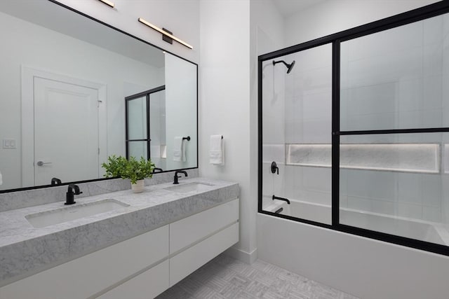 bathroom with bath / shower combo with glass door and vanity