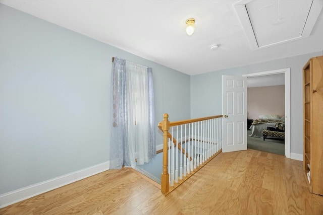 8 Stones Corner Rd, Berlin, MA 01503 - hall with attic access, an upstairs landing, and light wood-style flooring
