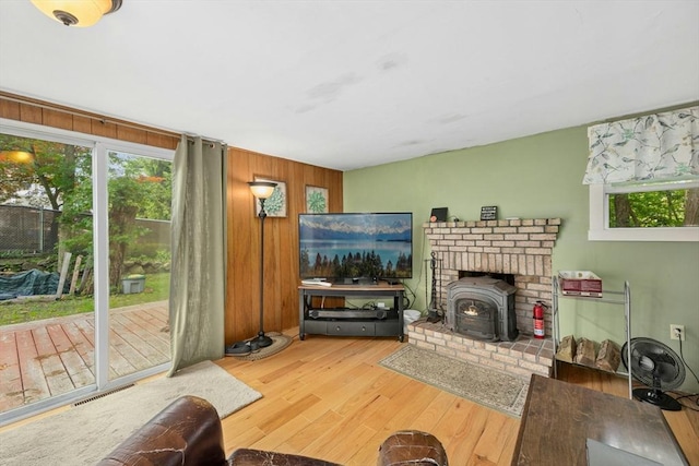 8 Stones Corner Rd, Berlin, MA 01503 - living area featuring wood finished floors, a wood stove, and wood walls