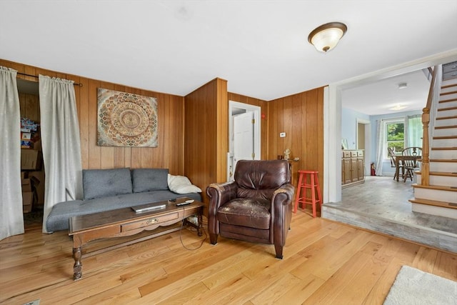 8 Stones Corner Rd, Berlin, MA 01503 - living room featuring wood finished floors, wooden walls, and stairs