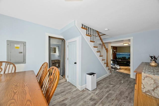 8 Stones Corner Rd, Berlin, MA 01503 - dining area with electric panel, stairway, and wood finished floors
