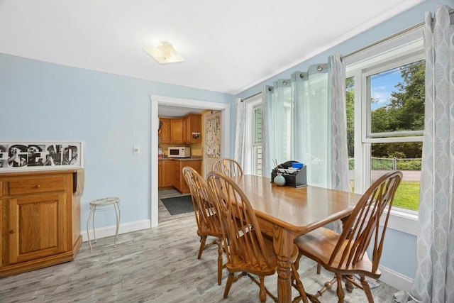 8 Stones Corner Rd, Berlin, MA 01503 - dining area with baseboards and light wood finished floors