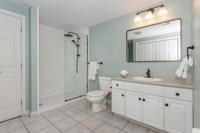 full bath with visible vents, a tile shower, vanity, tile patterned floors, and toilet