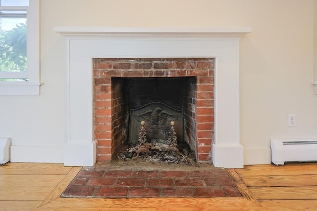 460 W Main Rd, Little Compton, RI 02837 - detailed view of radiator heating unit and a fireplace