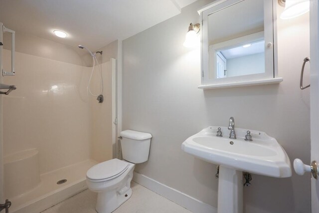 460 W Main Rd, Little Compton, RI 02837 - bathroom with toilet, a shower, and baseboards