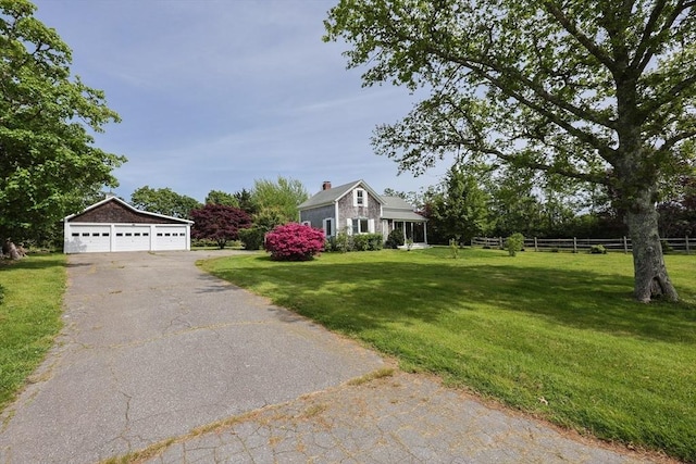 460 W Main Rd, Little Compton, RI 02837 - view of front of property with a chimney, a garage, an outdoor structure, and driveway