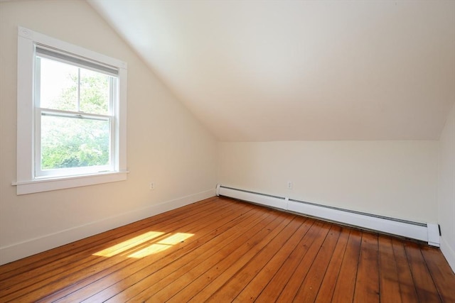 460 W Main Rd, Little Compton, RI 02837 - bonus room featuring a baseboard heating unit, lofted ceiling, wood-type flooring, and baseboards