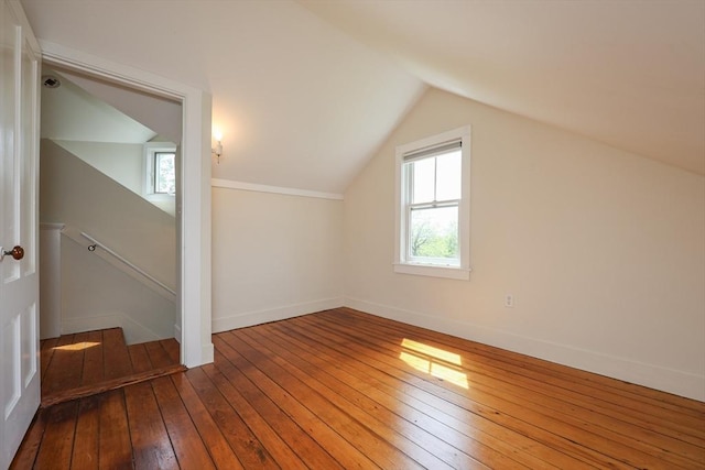 460 W Main Rd, Little Compton, RI 02837 - bonus room with healthy amount of natural light, hardwood / wood-style flooring, vaulted ceiling, and baseboards