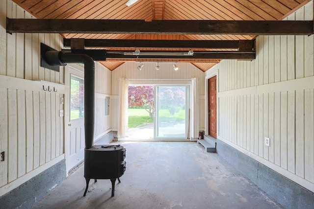 460 W Main Rd, Little Compton, RI 02837 - interior space featuring a wood stove, vaulted ceiling, and concrete flooring