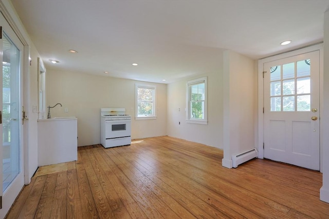460 W Main Rd, Little Compton, RI 02837 - kitchen featuring white gas stove, baseboard heating, light wood-style floors, recessed lighting, and a sink