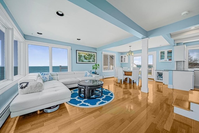75 Point Allerton Ave, Hull, MA 02045 - living area featuring light wood-style floors, plenty of natural light, beamed ceiling, a water view, and baseboards