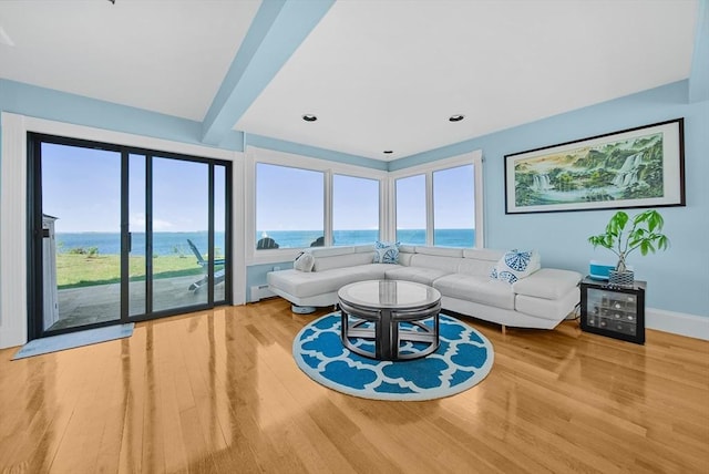 75 Point Allerton Ave, Hull, MA 02045 - living room featuring a water view, plenty of natural light, wood finished floors, beamed ceiling, and recessed lighting