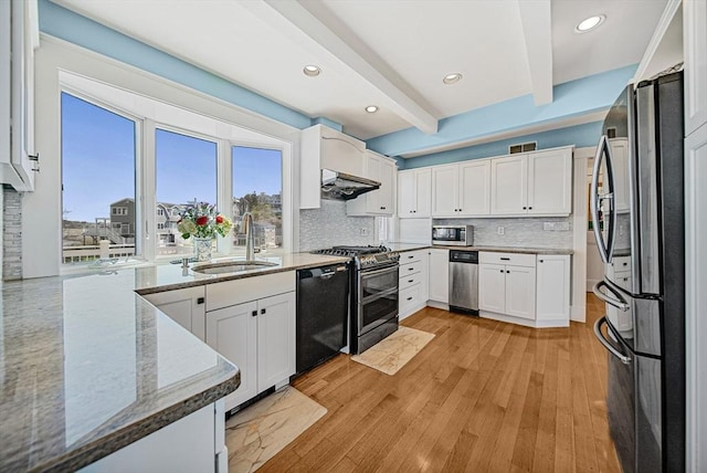 75 Point Allerton Ave, Hull, MA 02045 - kitchen featuring a sink, appliances with stainless steel finishes, beam ceiling, light stone counters, and backsplash