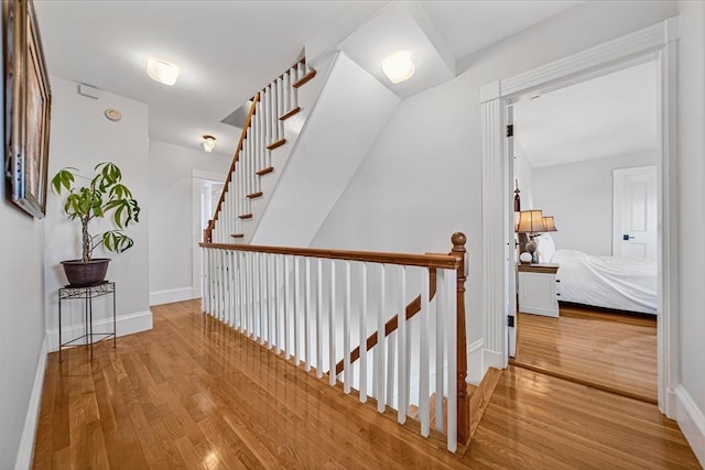 75 Point Allerton Ave, Hull, MA 02045 - corridor featuring wood finished floors, baseboards, and an upstairs landing